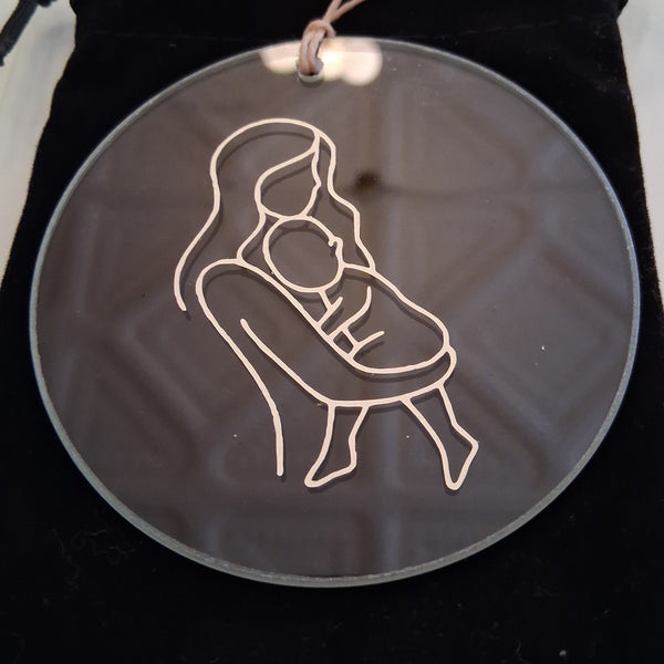 Transparent disc with a white line drawing of a person on a black drawstring bag.