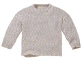 A long-sleeve knit sweater with a textured, speckled pattern in beige, white, and subtle pastel tones, shown against a plain off-white background.
