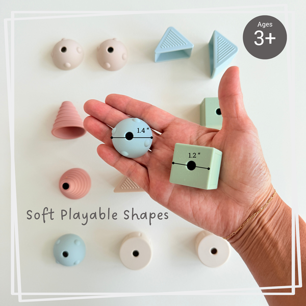 Hand holding soft play shapes with text indicating age suitability and product description.