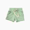 Light green shorts with a drawstring on a white background