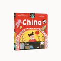 Board book titled 'China' from the Our World Series, featuring vibrant illustrations of Chinese culture and a young girl reading.
