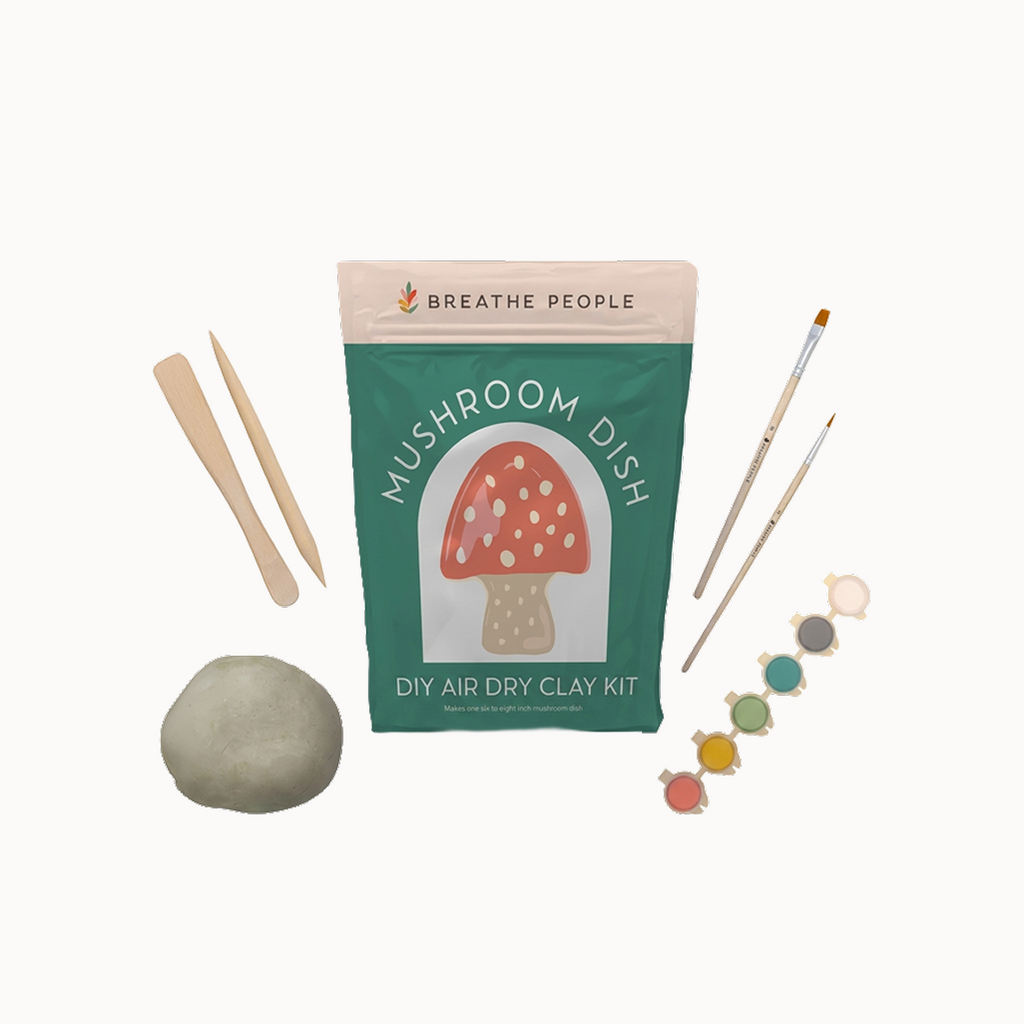 mushroom dish set on a white background with supplies surrounding