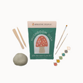 mushroom dish set on a white background with supplies surrounding