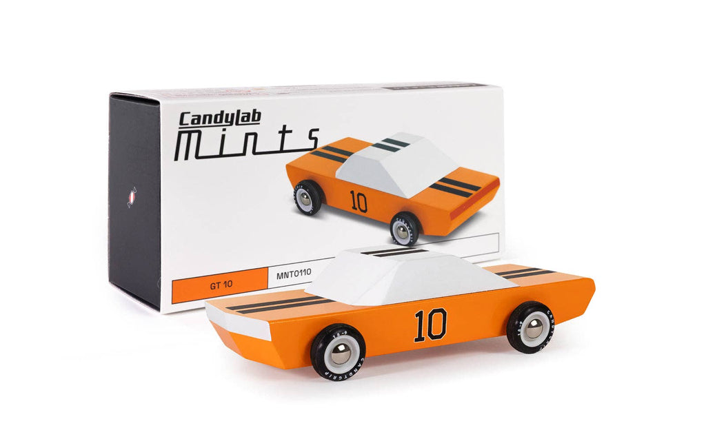 A wooden race car toy with an orange body, white roof, black racing stripes, and the number 10 on the side, shown against a plain off-white background.