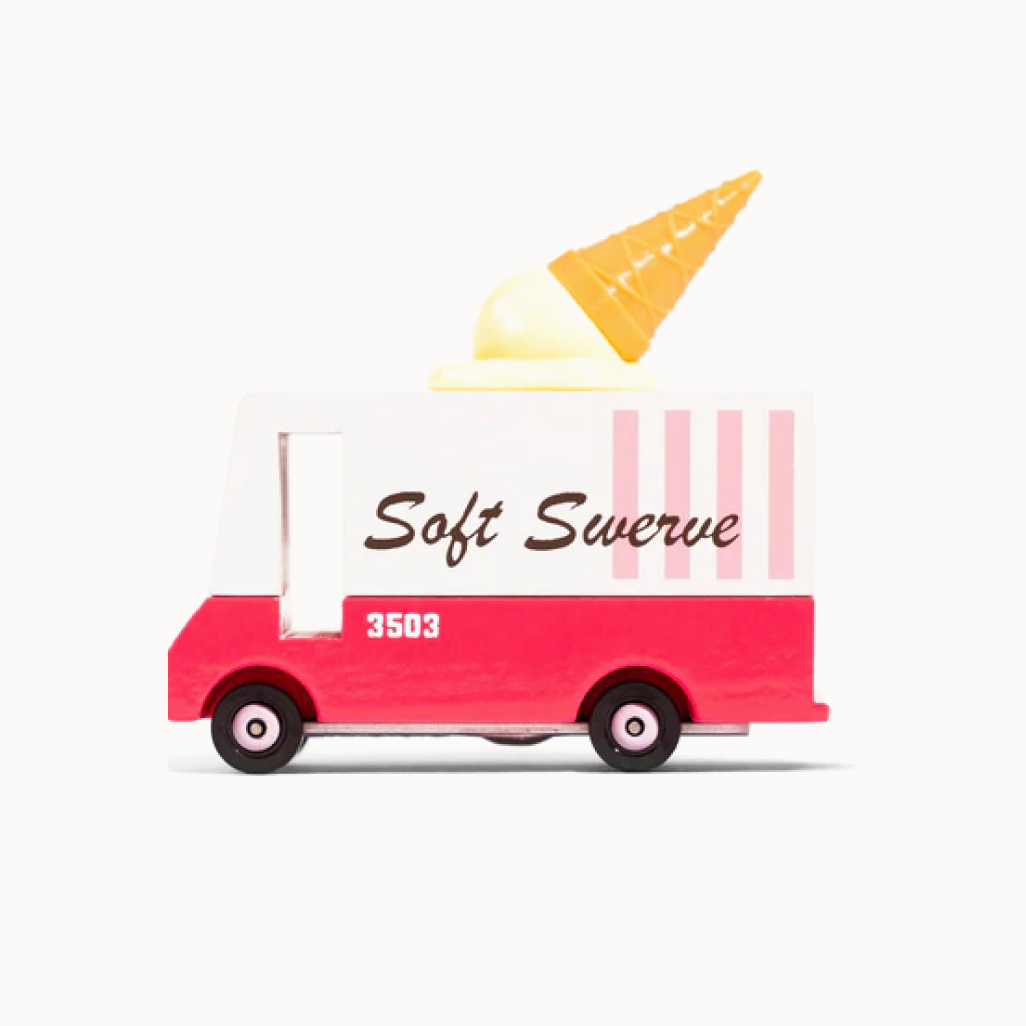Toy ice cream truck with a soft serve cone on top against a white background