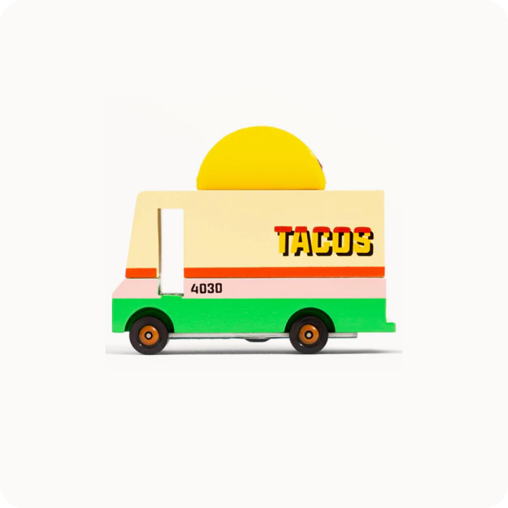 Toy taco truck with a yellow taco on top against a white background