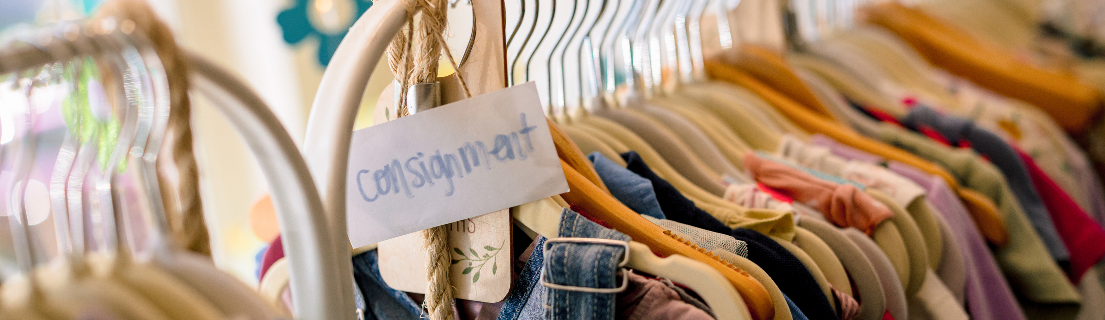 Rack of consignment clothes items.