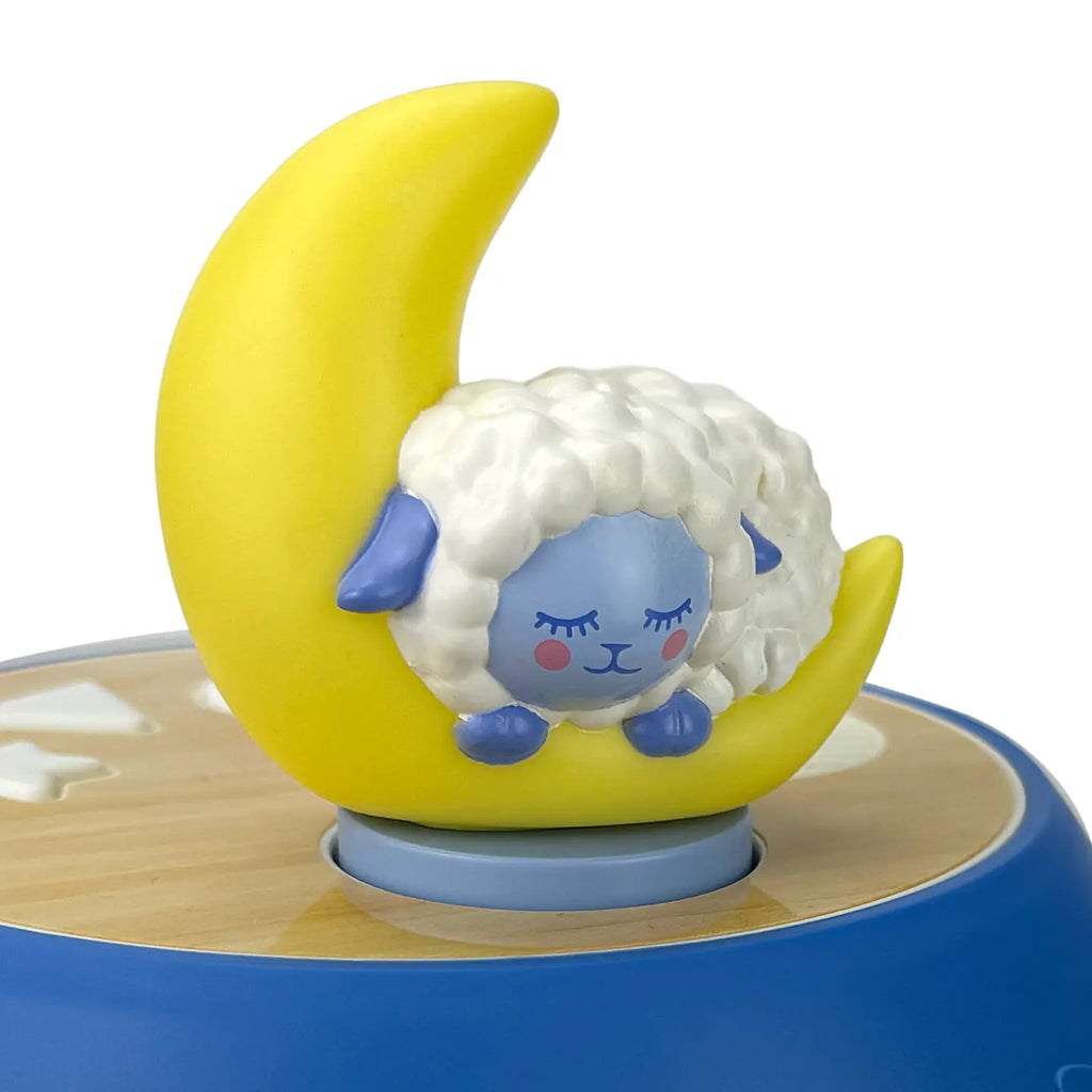 sheep sleeping on a moon figuine