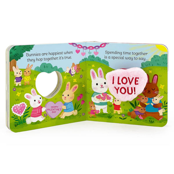 Children's book with cartoon bunnies and heart-themed pages on a white background