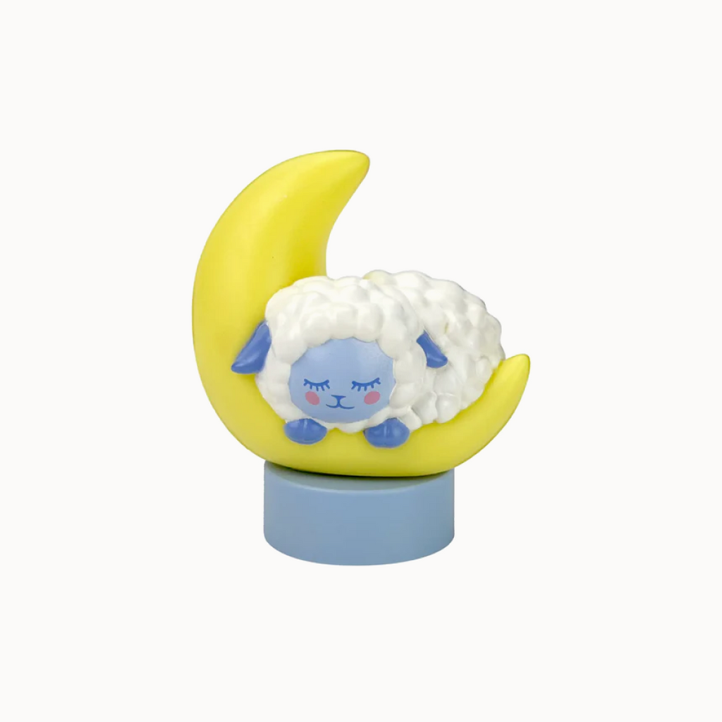 sheep sleeping on a moon on white background