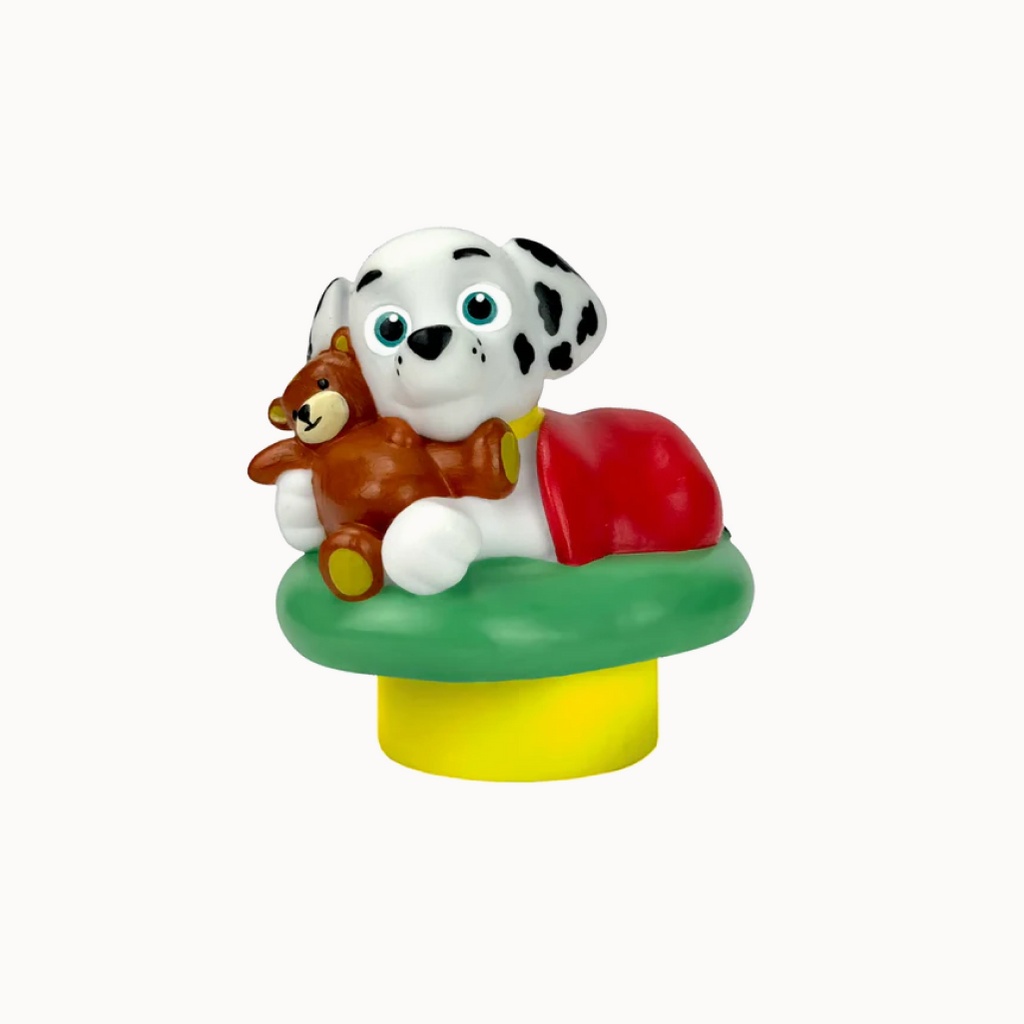 Toy figure of a dalmatian dog with a teddy bear on a white background