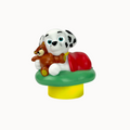 Toy figure of a dalmatian dog with a teddy bear on a white background