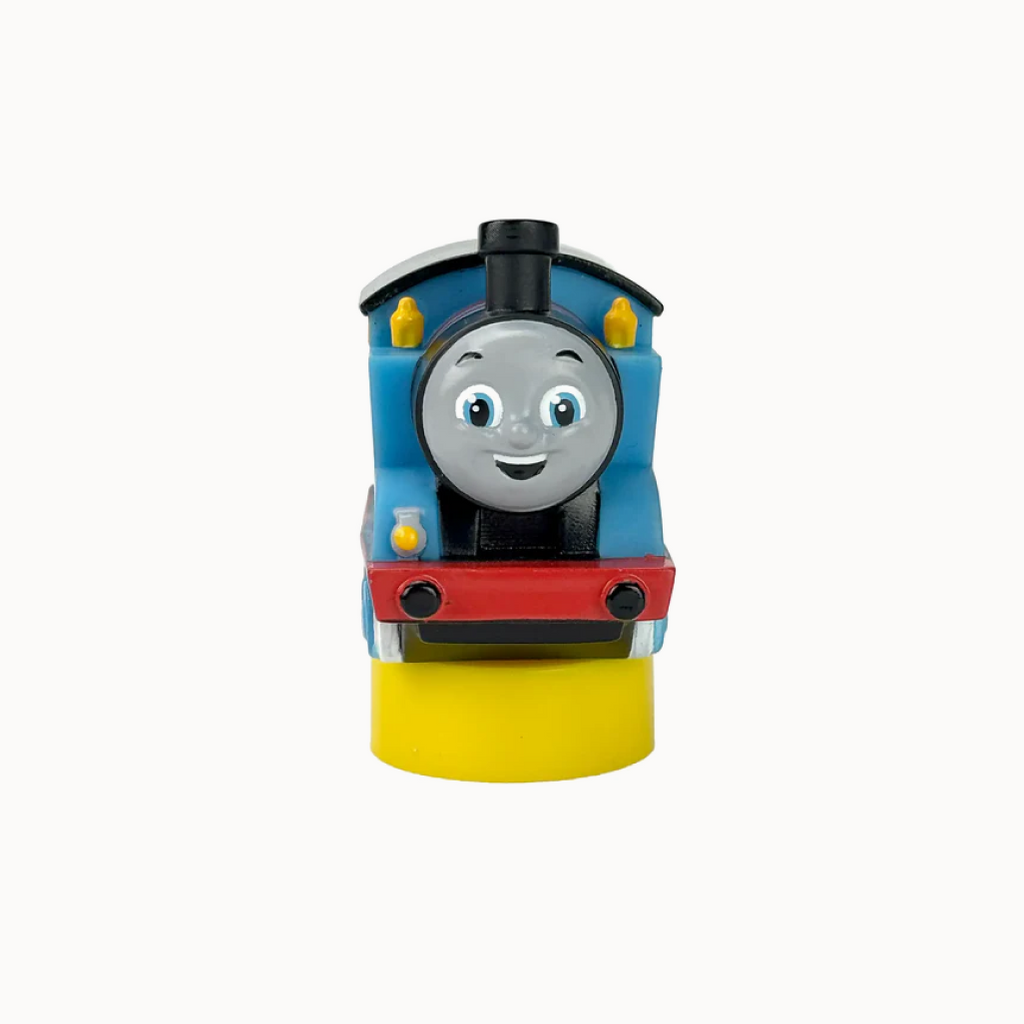 Toy train engine with a smiling face on a white background