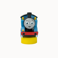 Toy train engine with a smiling face on a white background