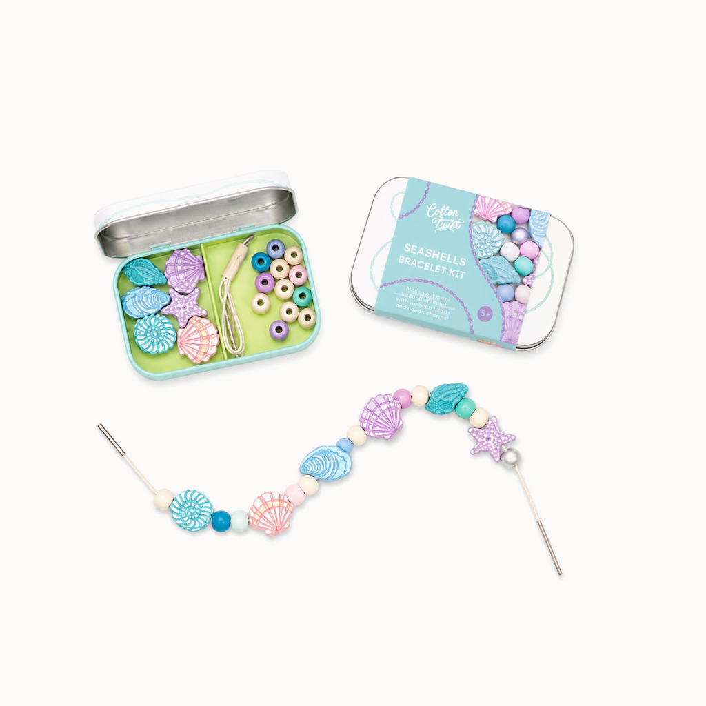 Seashell bracelet kit with open tin and completed bracelet on a white background