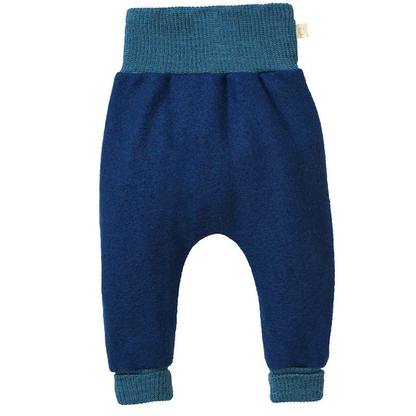 A pair of blue boiled wool bloomers for babies, with a high waistband and long leg cuffs.