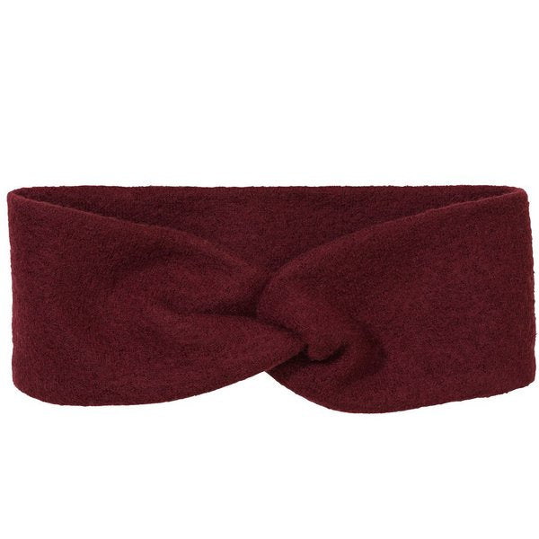 A red boiled wool headband with a twist in the middle, presented on a neutral background.