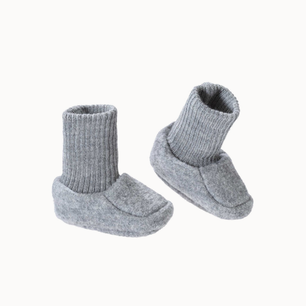 Pair of gray baby booties on a white background
