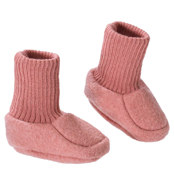 Pair of pink baby booties on a white background