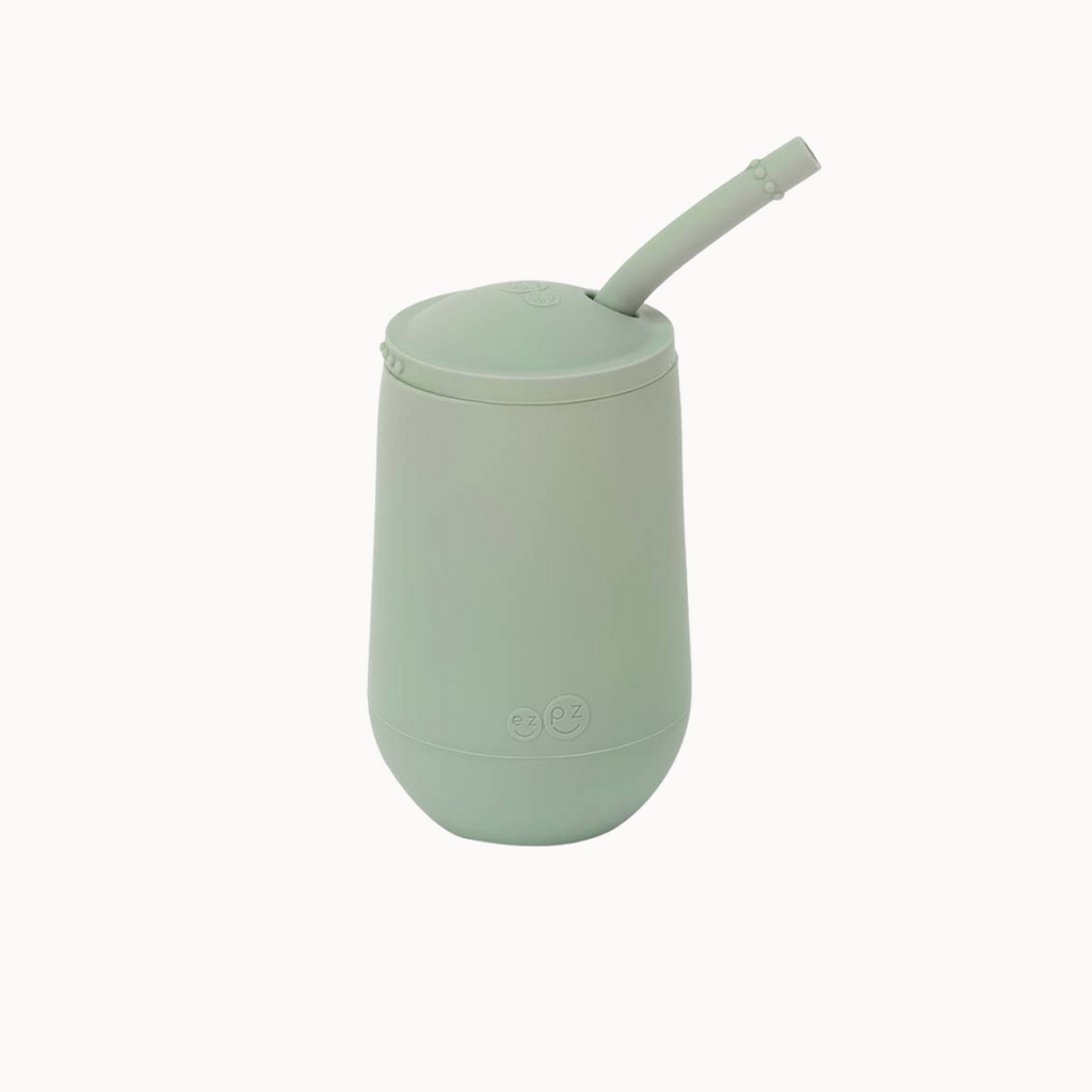 Mint green tumbler with a straw on a white background