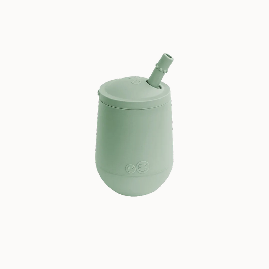 EZPZ Mini Cup and Straw Training System packaging, showing a green silicone mini cup with a straw.