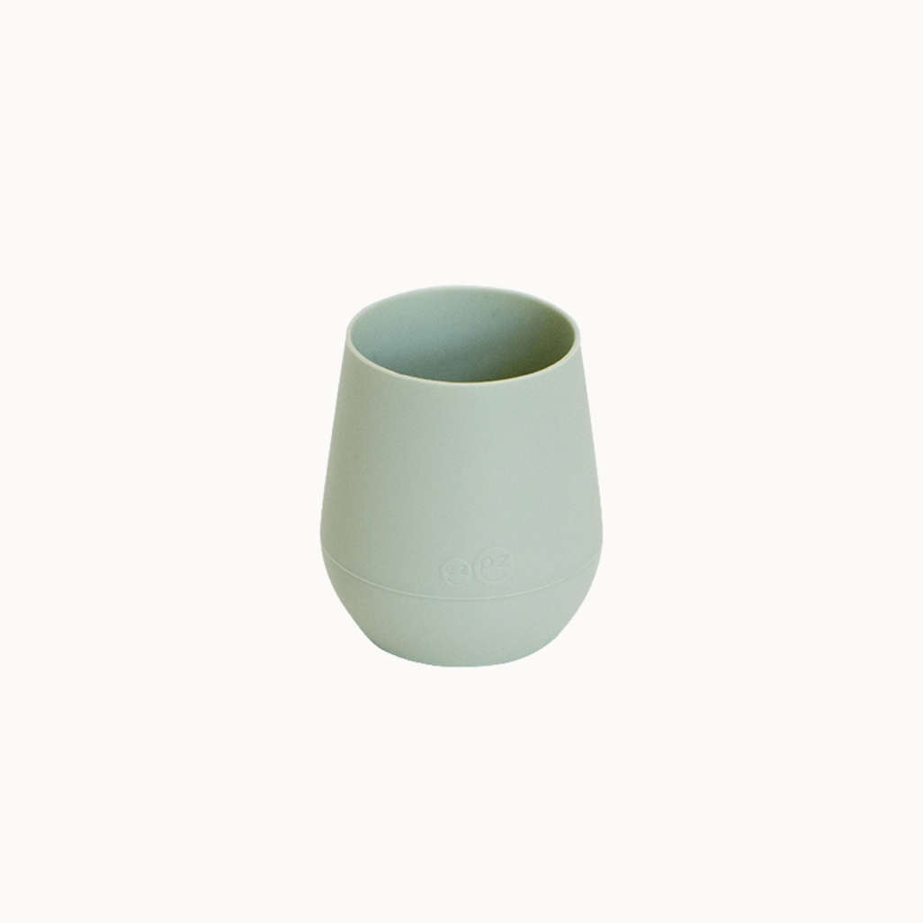 A small green EZPZ silicone cup.