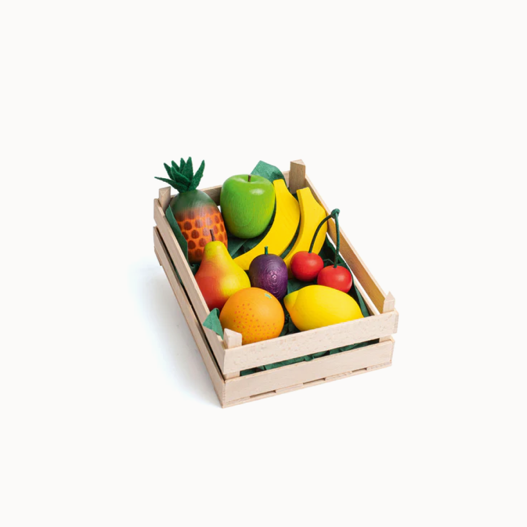 Set of toy fruits in a wooden crate on a white background