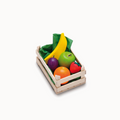 Toy fruit set in a wooden crate on a white background