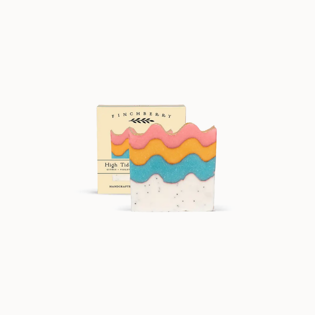 Colorful soap bar with wavy layers and 'Finchberry' packaging on a white background