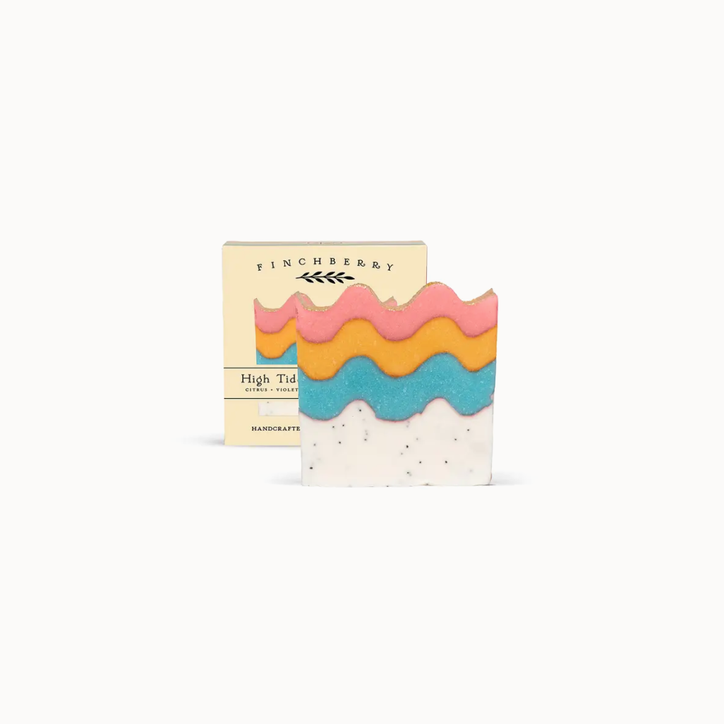 Colorful soap bar with wavy layers and 'Finchberry' packaging on a white background