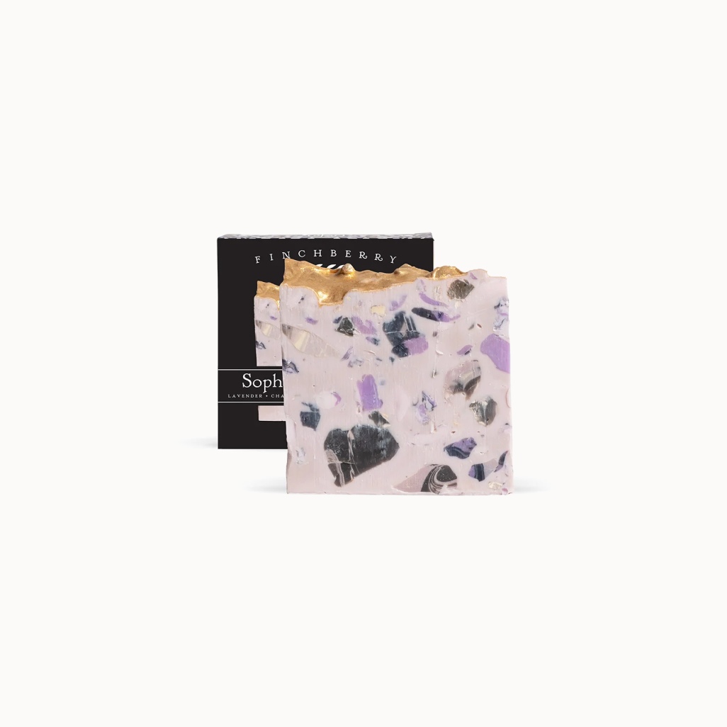 Finchberry soap bar with gold top and black box in the background