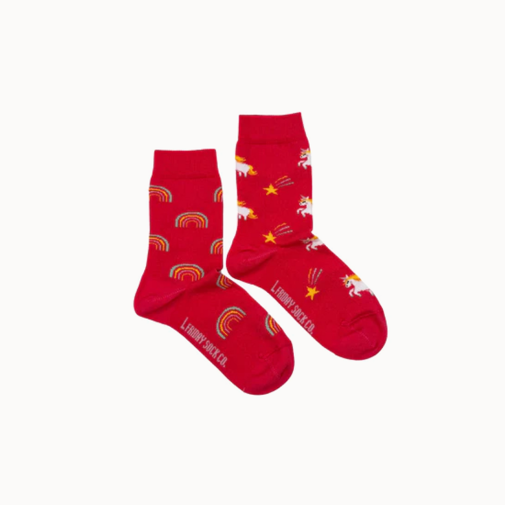 Red socks with unicorn and rainbow patterns on a white background