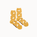 yellow socks with bunnies on them on white background