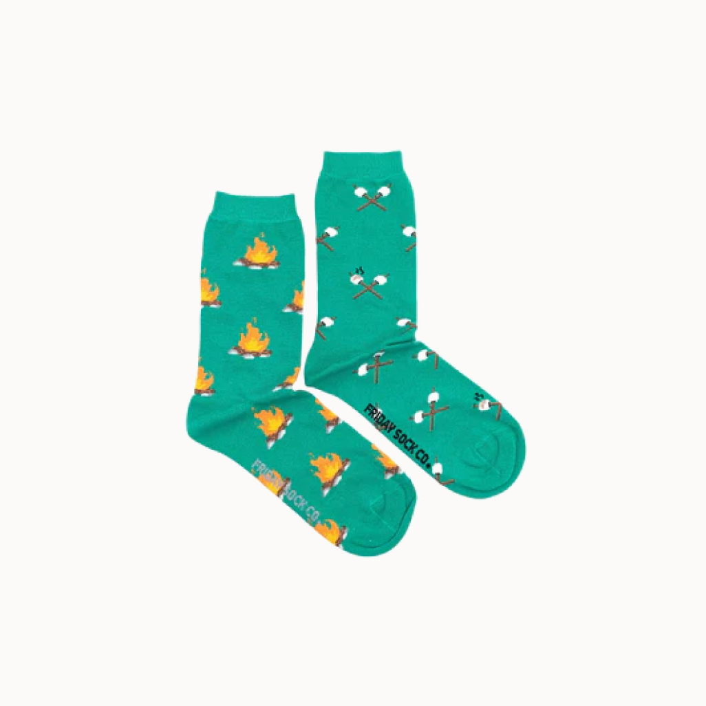 Two green socks with campfire and marshmallow patterns on a white background, featuring the brand 'Fridays Sock Co.'