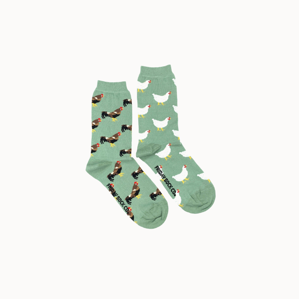 Two pairs of socks with chicken patterns on a white background.