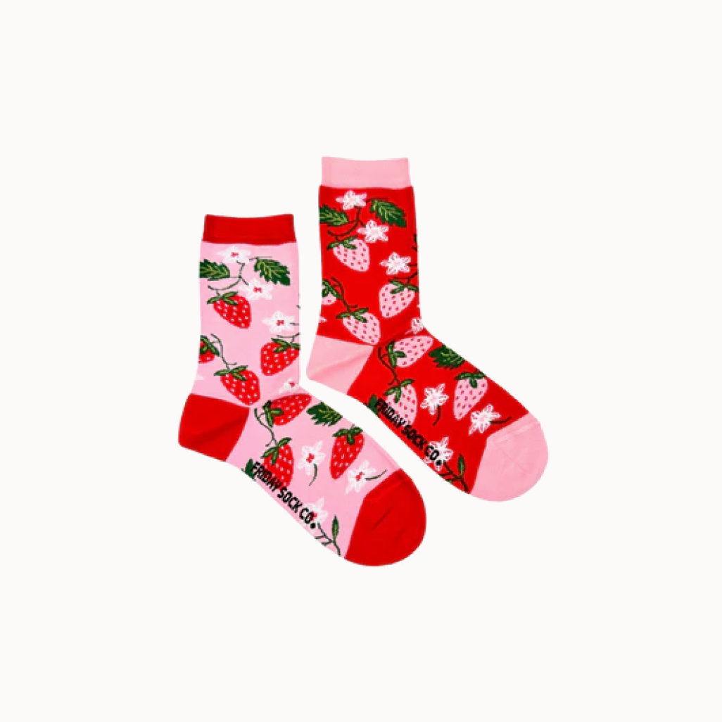 Two socks with strawberry pattern on a white background.