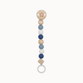 Teething ring with colorful beads on a white background