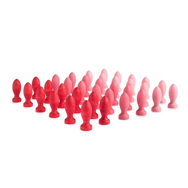 Set of red and pink wooden flower petals on a white background