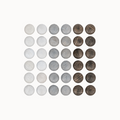 Set of round wooden stones in various shades of gray and brown on a white background
