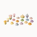 Set of small, colorful wooden toys on a white background