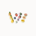 Small wooden play fruits on a white background