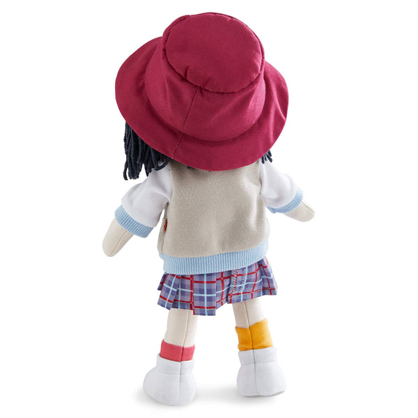 Plush toy with a red hat, beige sweater, plaid skirt, and yellow socks on a white background