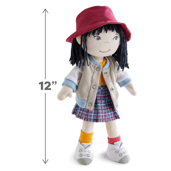 Doll with a red hat and plaid skirt, standing next to a height measurement label indicating 12 inches.