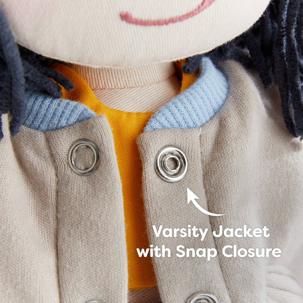 Close-up of a varsity jacket with snap closure on a toy, labeled 'Varsity Jacket with Snap Closure'.