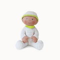 Plush baby doll with a green hat and bib on a white background