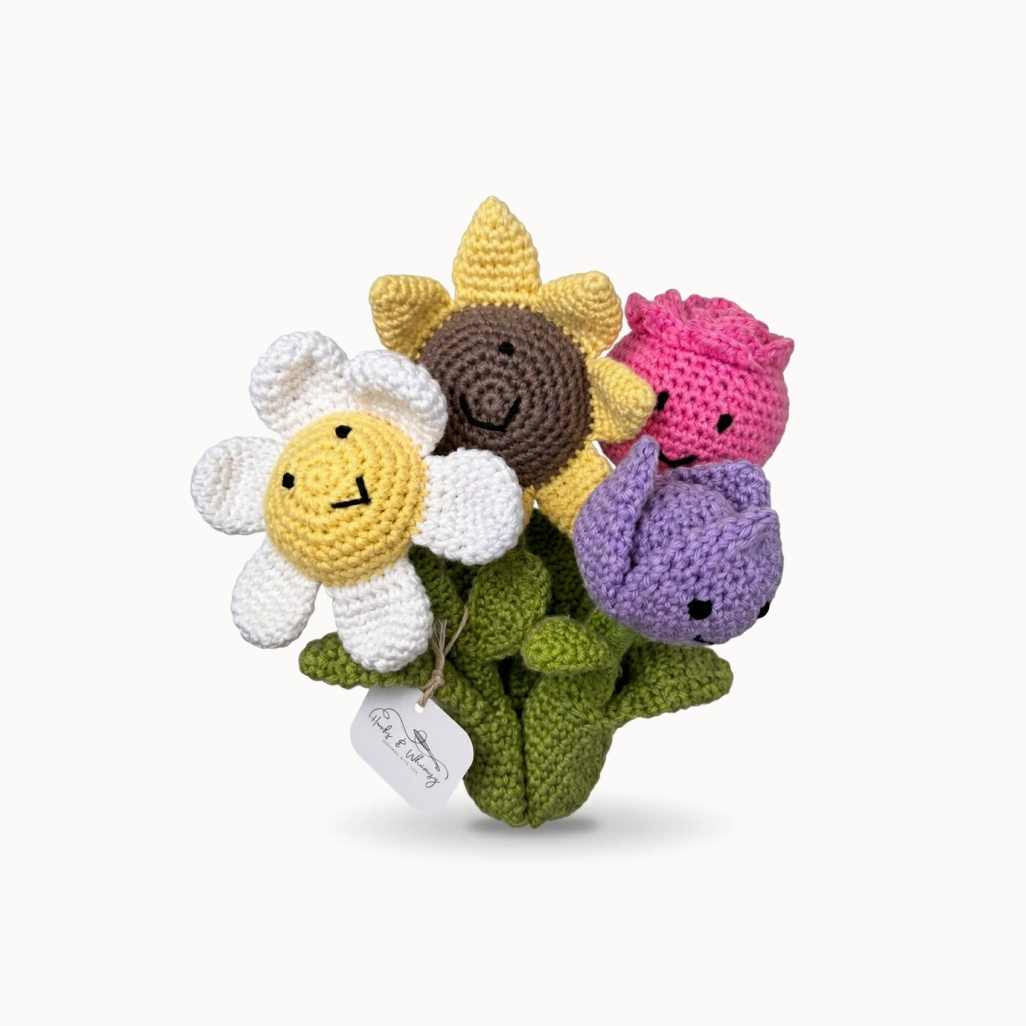 Collection of colorful crocheted flowers on a white background
