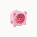 Pink pig-shaped container with a white background