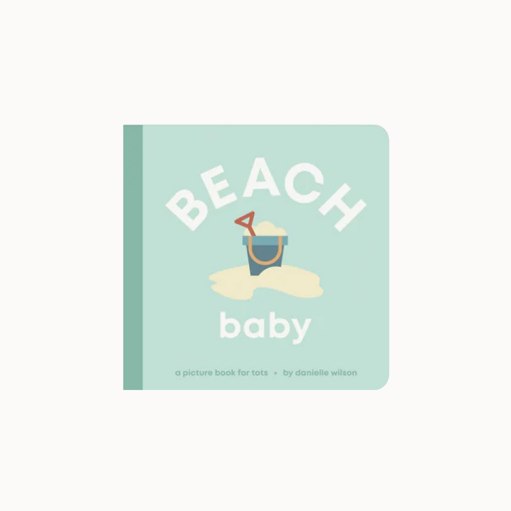 Book titled 'Beach Baby' with a sand bucket and shovel illustration on a light green background