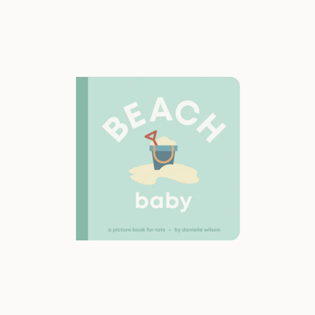 Book titled 'Beach Baby' with a sand bucket and shovel illustration on a light green background