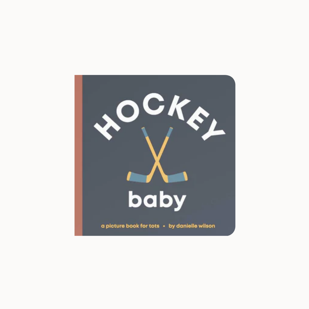 Book titled 'Hockey Baby' with hockey sticks on a dark blue background